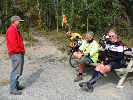 Pete talking with bicycle tourists